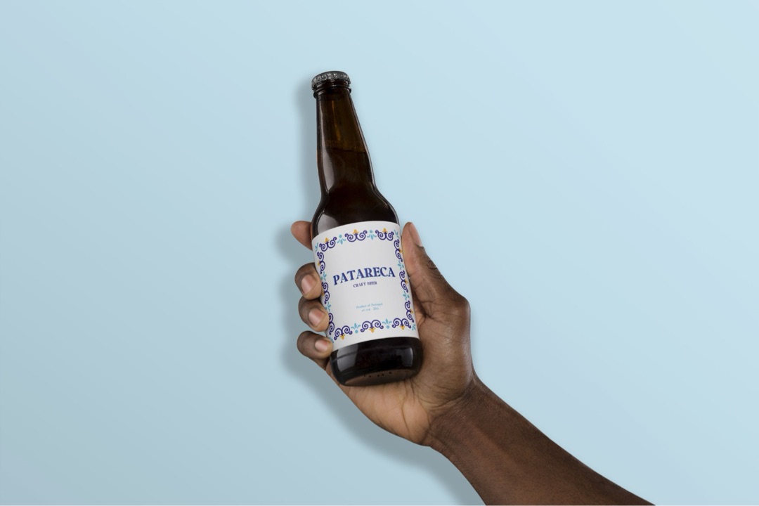 Hand holding a bottle of Patareca
