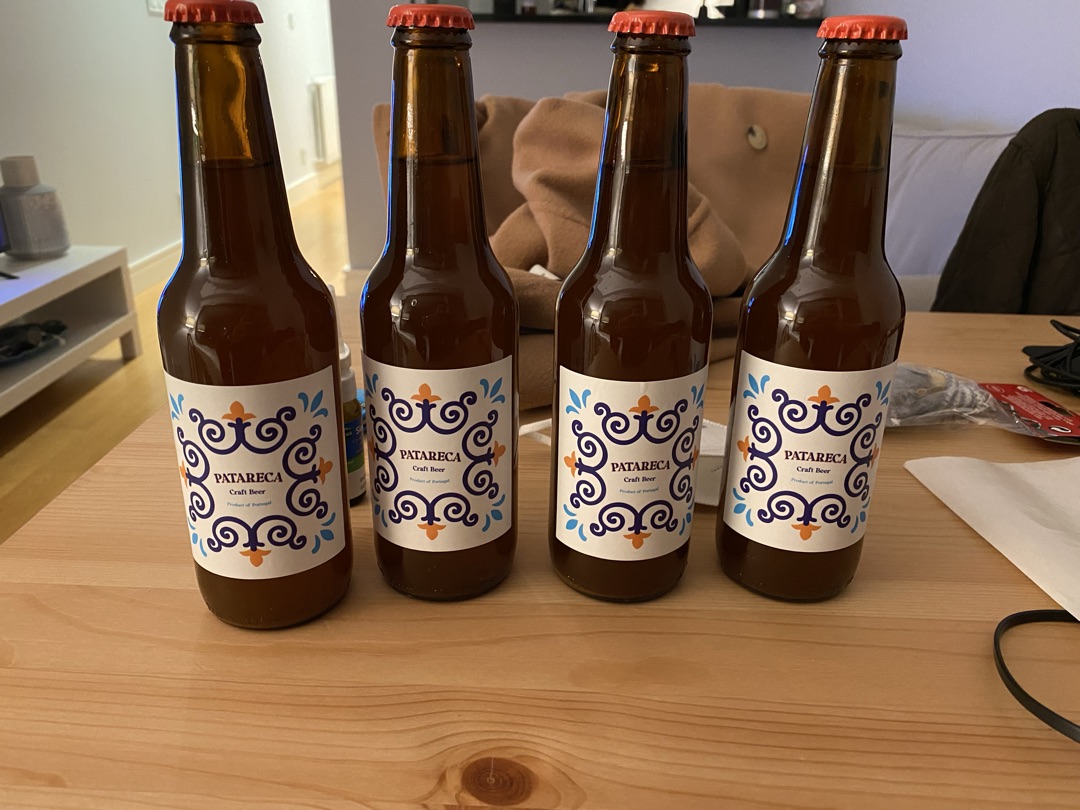 Four freshly labelled Patareca bottles on a table