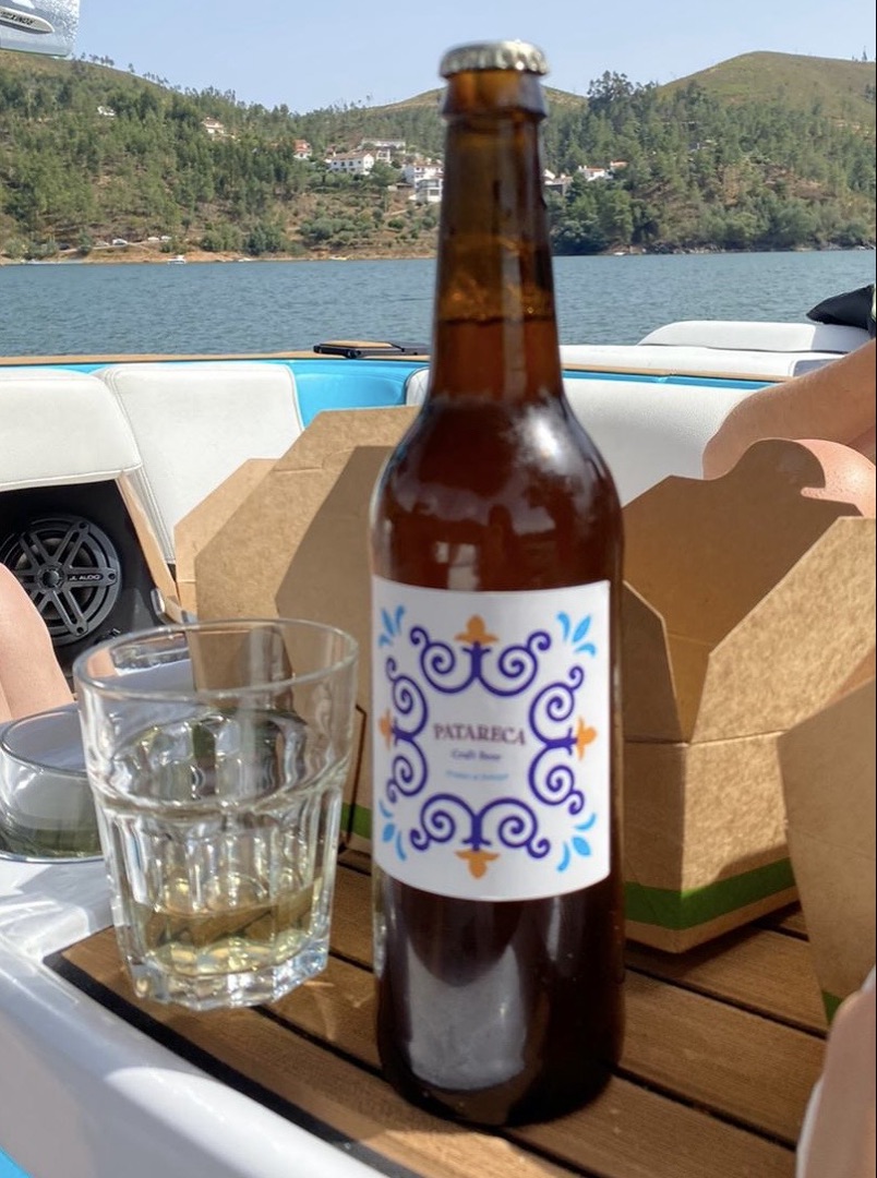 Patareca bottle and a glass on a boat table